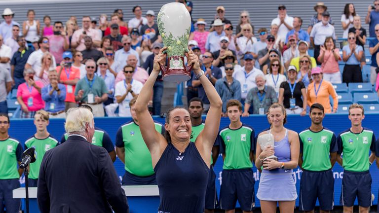 Caroline Garcia holds up the Rookwood Trophy for winning the championship of the Western and Southern Open in Cincinnati