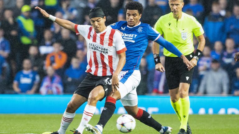 PSV's Erick Gutierrez and Rangers'  Malik Tillman challenge for the ball