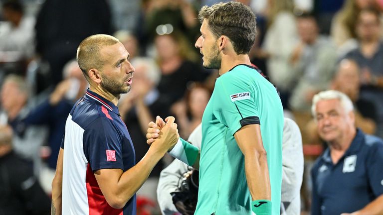 Daniel Evans of Great Britain congratulates Pablo Carreno Busta of Spain for his victory in the semifinals during Day 8 of the National Bank Open