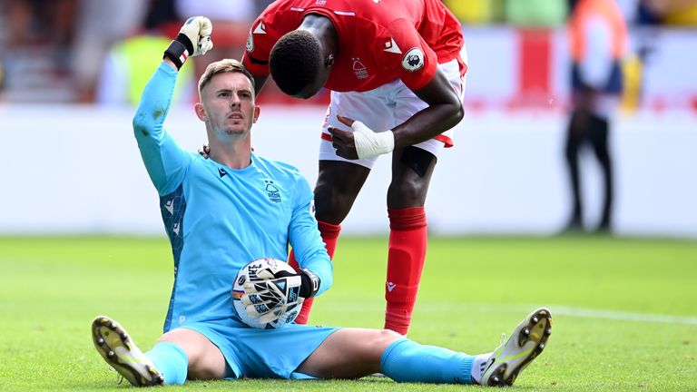 Dean Henderson celebrates after saving Declan Rice's penalty