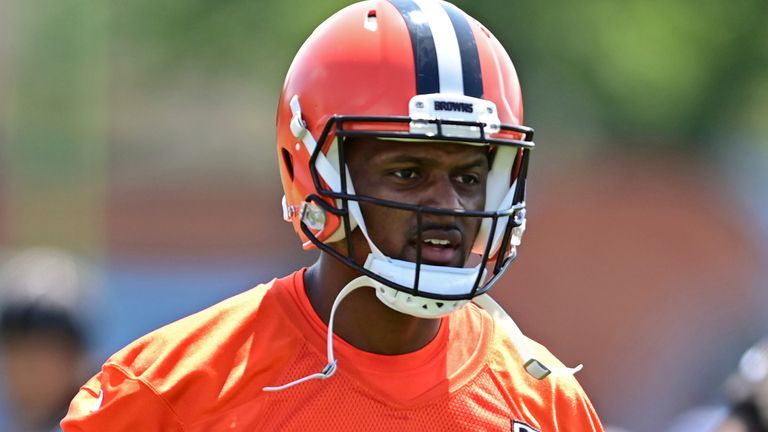 Cleveland Browns quarterback Deshaun Watson walks during an NFL football practice in Berea, Ohio, Saturday, July 30, 2022. (AP Photo/David Dermer)