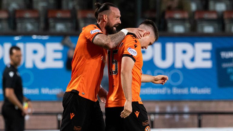 Dundee United's Steven Fletcher (L) celebrates with goalscorer Glenn Middleton (R)