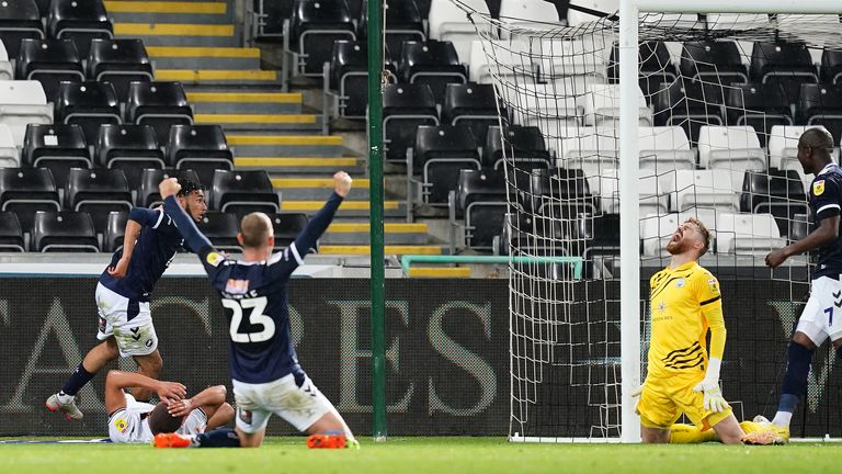 An own goal by Swansea City&#39;s Nathan Wood hands Millwall a 2-2 draw in the Championship.
