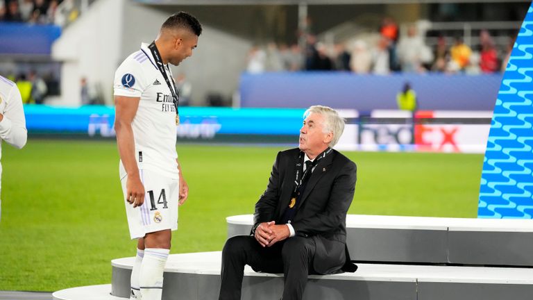 Real Madrid&#39;s Casemiro, left, speaks with Real Madrid&#39;s head coach Carlo Ancelotti after winning the UEFA Super Cup final soccer match between Real Madrid and Eintracht Frankfurt at Helsinki&#39;s Olympic Stadium, Finland, Wednesday, Aug. 10, 2022. (AP Photo/Sergei Grits)