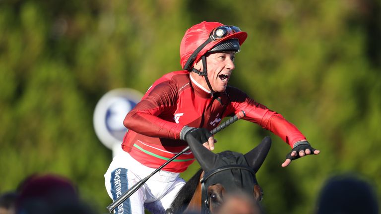 Frankie Dettori performs his famous flying dismount after victory in the Racing League at Lingfield
