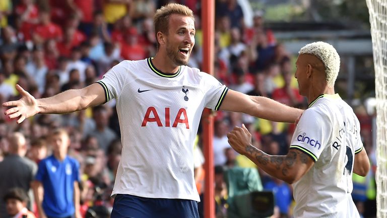 Harry Kane celebrates his second goal with team-mate Richarlison
