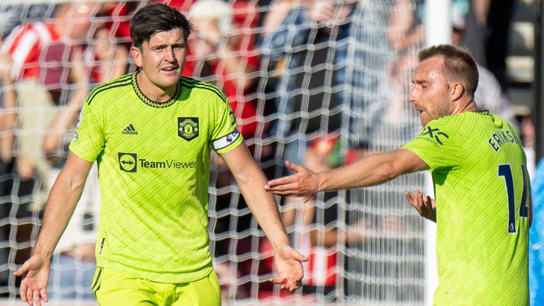 Christian Eriksen gestures towards Harry Maguire after Manchester United concede a goal at Brentford