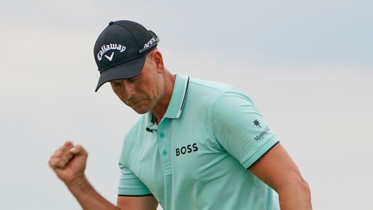 Henrik Stenson of Sweden reacts after sinking a putt on the 17th hole during the final round of the LIV Golf Invitational at Trump National in Bedminster, N.J., Sunday, July 31, 2022. (AP Photo/Seth Wenig)