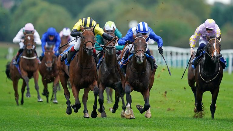 Ikhtiraaq (blue and white) wins at Leicester in the colours of former owners Shadwell