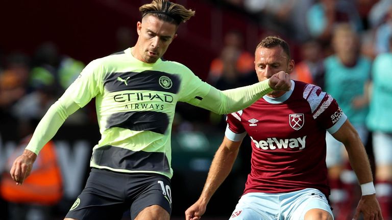 Manchester City's Jack Grealish (left) and West Ham United's Vladimir Coufal battle for the ball 