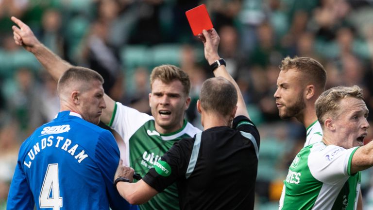Referee Willie Collum shows John Lundstram a red card