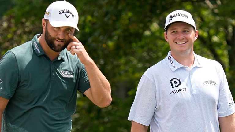 Jon Rahm, of Spain, left, and Sepp Straka, of Austria, walk to the third green during the second round of the Tour Championship golf tournament at East Lake Golf Club, Friday, Aug. 26, 2022, in Atlanta. (AP Photo/Steve Helber)