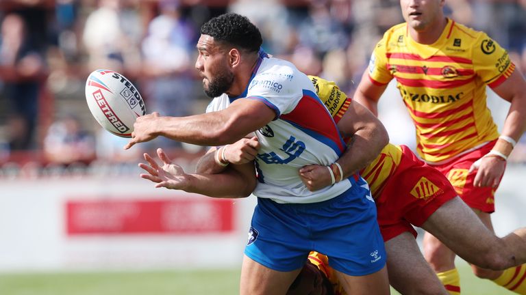 Wakefield Trinity's Kelepi Tanganoa passes the ball out of a tackle. (Photo: John Clifton/SWpix.com)