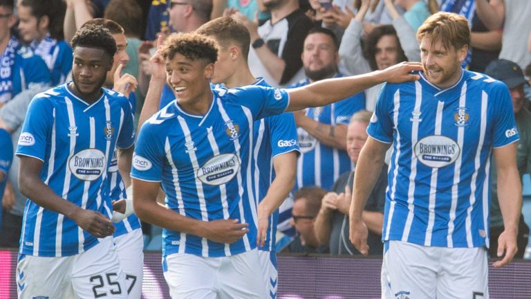 KILMARNOCK, SCOTLAND - AUGUST 27: Kilmarnocks' Ash Taylor (R) celebrates making it 2-1 with his teammates during a crucial Premiership match between Kilmarnock and Motherwell at Rugby Park on August 27 in Kilmarnock, Scotland.  (Photo by Craig Foy / SNS Group)