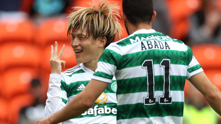 Kyogo Furuhashi celebrates after completing a hat-trick in the first half at Tannadice