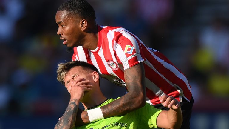 Lisandro Martinez goes down after a clash with Ivan Toney