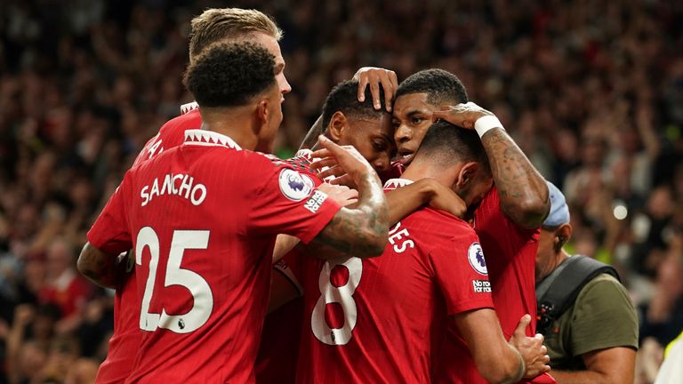 Marcus Rashford celebrates with Manchester United team-mates after scoring against Liverpool