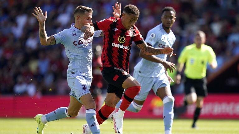 Bournemouth forward Marcus Tavernier skips past Lucas Digne