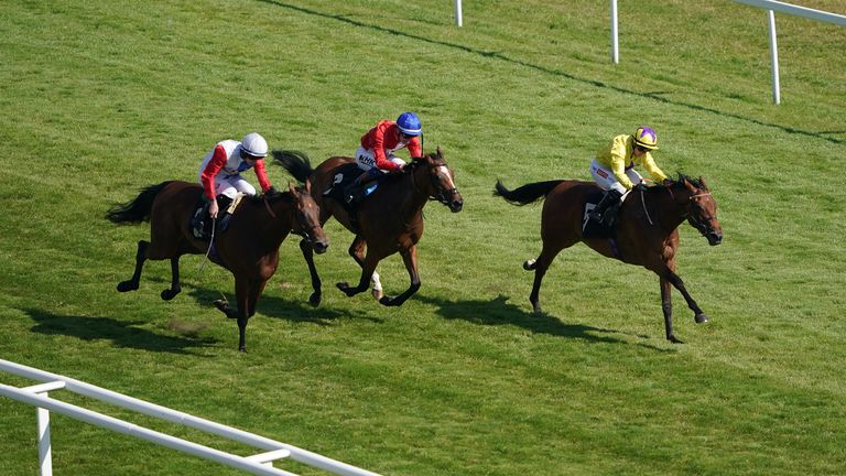Morgan Fairy, ridden by Hollie Doyle (right), on the way to winning at Newbury