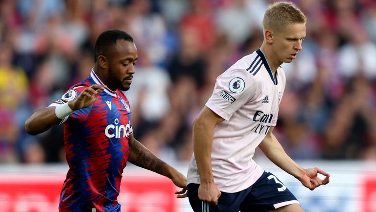 Crystal Palace's Jordan Ayew, left, duels for the ball with Arsenal's Oleksandr Zinchenko