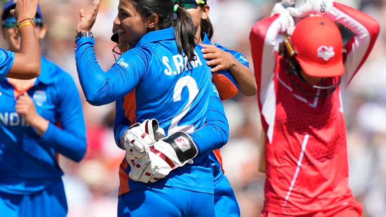 India's Sneh Rana celebrates with team-mates the dismissal of England's Danni Wyatt, during the women's cricket T20 semi-final at the Commonwealth Games