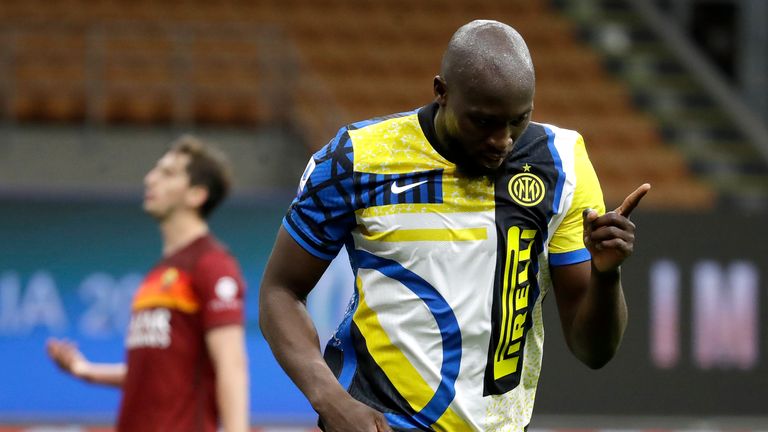 Inter Milan's Romelu Lukaku celebrates after scores the third goal of his team during a Serie A soccer match between Inter Milan and Roma at the San Siro stadium in Milan, Italy, Wednesday, May 12, 2021. (AP Photo/Luca Bruno)
