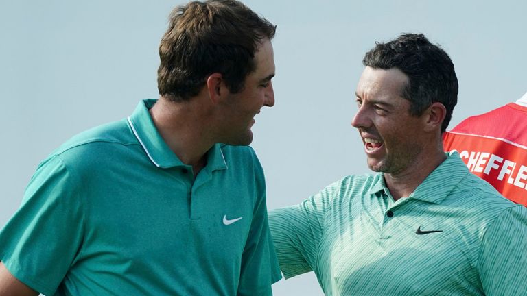 Rory McIlroy, of Northern Ireland, right, celebrates his victory with Scottie Scheffler during the final round of the Tour Championship golf tournament at East Lake Golf Club, Sunday, Aug. 28, 2022, in Atlanta. (AP Photo/John Bazemore) 
