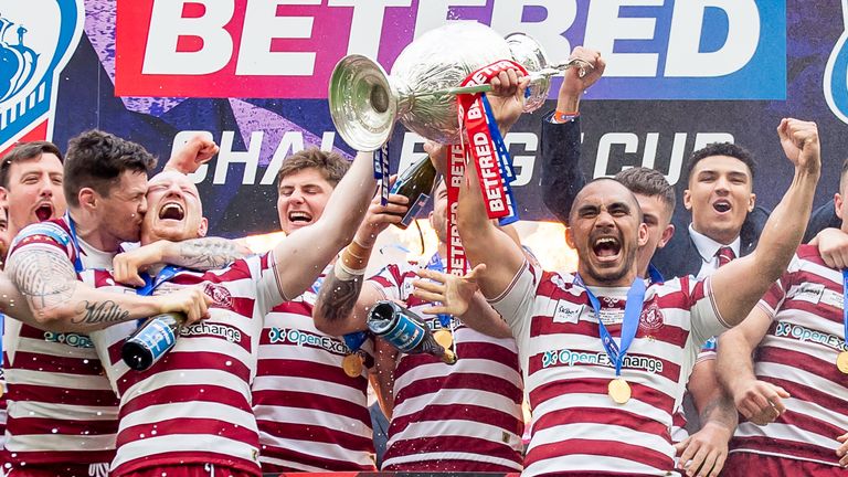 Picture by Allan McKenzie/SWpix.com - 28/05/2022 - Rugby League - Betfred Challenge Cup Final - Huddersfield Giants v Wigan Warriors - Tottenham Hotspur Stadium, London, England - Wigan's Liam Farrell & Thomas Leuluai lift the Betfred Challenge trophy after victory against Huddersfield.