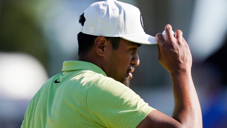 Tony Finau tips his hat after his birdie putt on the 17th green during the final round of the Rocket Mortgage Classic golf tournament, Sunday, July 31, 2022, in Detroit. (AP Photo/Carlos Osorio)