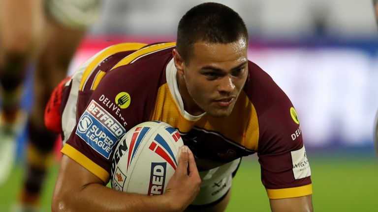Huddersfield Giants' Tui Lolohea dives in to score his sides fourth try of the game during the Betfred Super League match at John Smith's Stadium, Huddersfield. Picture date: Thursday August 18, 2022.
