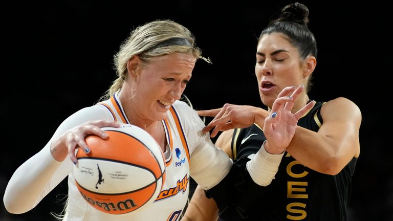 Phoenix Mercury guard Sophie Cunningham (9) drives into Las Vegas Aces guard Kelsey Plum (10) during the second half in Game 1 of a WNBA basketball first-round playoff series Wednesday, Aug. 17, 2022, in Las Vegas. (AP Photo/John Locher)