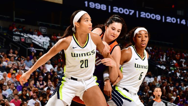  Isabele Harrison #20 and Kayla Thornton #6 of the Dallas Wings plays defense on Megan Gustafson #10 of the Phoenix Mercury during the game on August 12, 2022 at Footprint Center in Phoenix, Arizona.