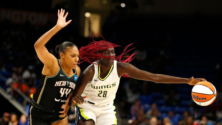 AUGUST 8: Betnijah Laney #44 of the New York Liberty plays defense on Awak Kuier #28 of the Dallas Wings during the game on August 8, 2022 at the College Park Center in Arlington, Texas.