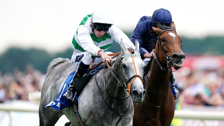 Luke Morris gets to work on Alpinista to fend off the challenge of Tuesday in the Yorkshire Oaks
