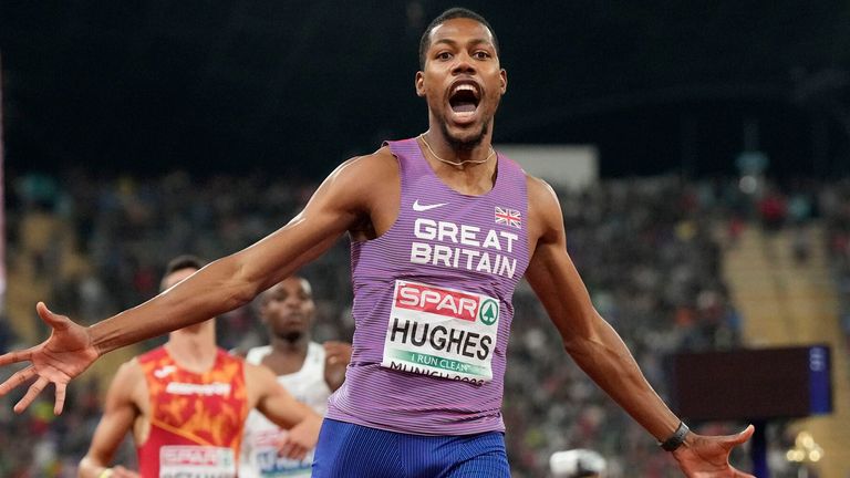Zharnel Hughes, of Great Britain, celebrates after winning the gold medal in the Men's 200m