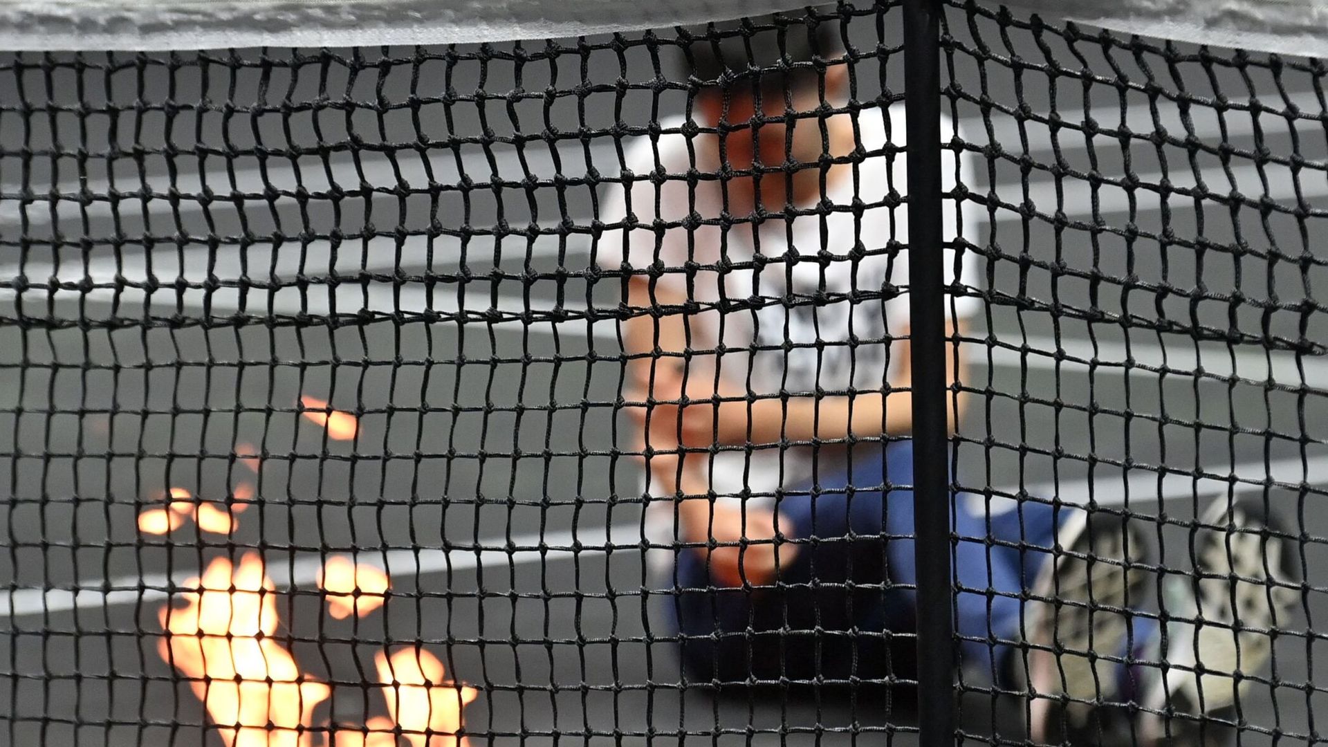 Man appears to set fire to his arm during on-court protest at Laver Cup