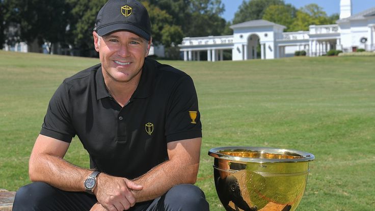 International Team captain Trevor Immelman poses with the Presidents Cup during the Captain's Visit for 2022 Presidents Cup at Quail Hollow Club 