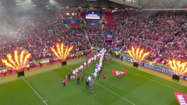 The crowd welcomes Leeds Rhinos and St Helens out ahead of the Super League Grand Final.