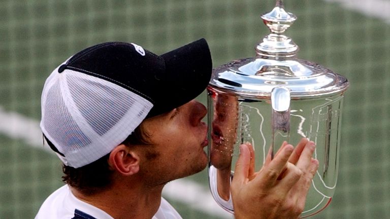 Andy Roddick of the United States kisses his trophy after beating Spain's Juan Carlos Ferrero 6-3, 7-6(2), 6-3 to win the men's final at the US Open tennis tournament on Sunday September 7, 2003 in New York.  (AP Photo/Charles Krupa)