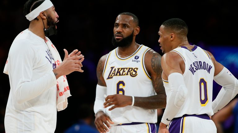 Anthony Davis, LeBron James and Russell Westbrook discuss matters on court for the Los Angeles Lakers