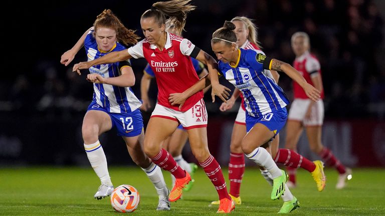 Arsenal's Lia Walti takes on Brighton's Libby Bance and Julia Zigiotti