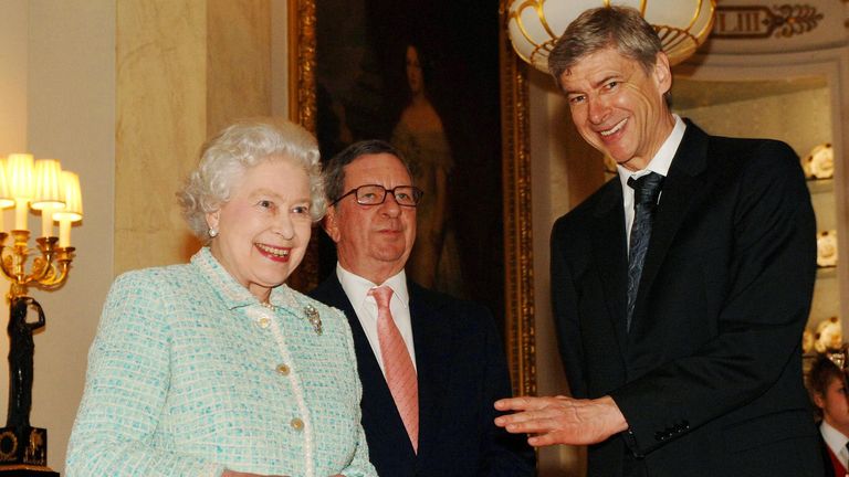 Queen Elizabeth II meets former Arsenal manager Arsene Wenger at Buckingham Palace.