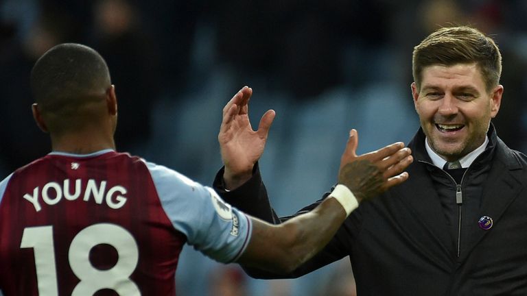 Aston Villa&#39;s head coach Steven Gerrard, center, celebrates with Aston Villa&#39;s Ashley Young after their win in the English Premier League soccer match between Aston Villa and Leicester City at Villa Park in Birmingham, England, Sunday, Dec. 5, 2021. Aston Villa won the match 2-1. (AP Photo/Rui Vieira)