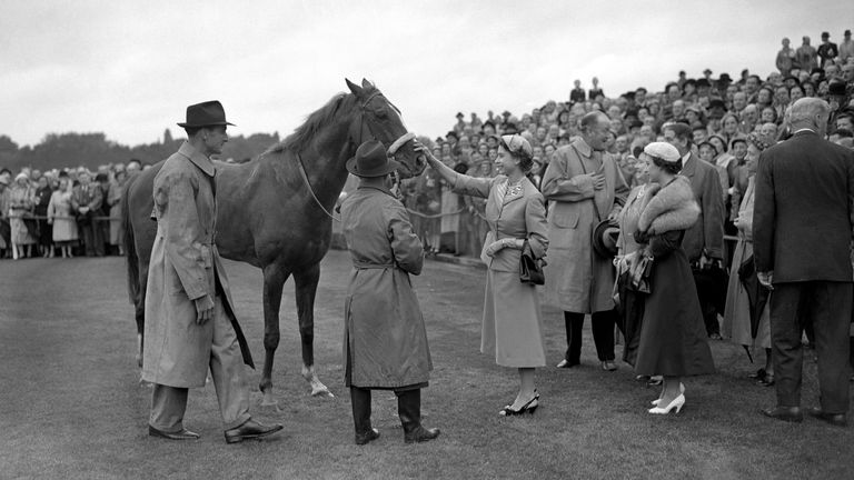 The Queen greets Aureole after victory in the King George VI and the Queen Elizabeth Stakes
