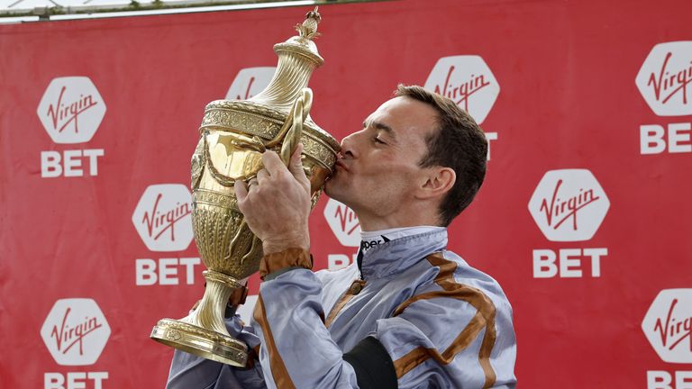 Jockey Danny Tudhope plants a kiss on the Ayr Gold Cup