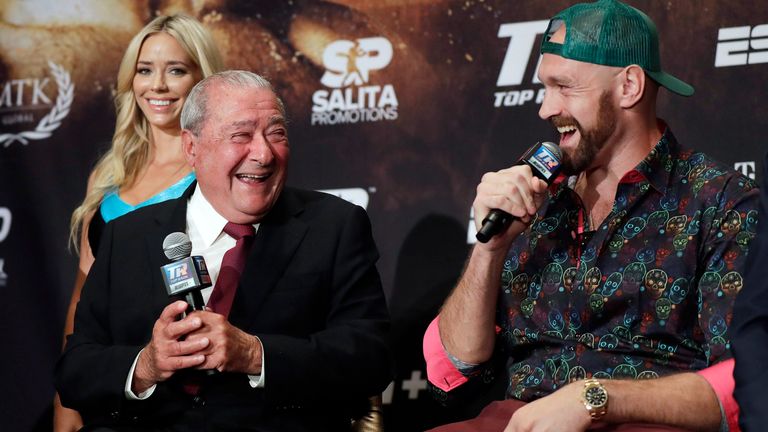 Otto Wallin, of Sweden, left, promoter Bob Arum and Tyson Fury, right, laugh during a news conference Wednesday, Sept. 11, 2019, in Las Vegas. Wallin and Fury will face each other in a heavyweight boxing match Saturday. (AP Photo/Isaac Brekken)