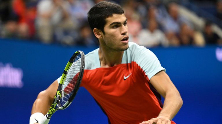 Carlos Alcaraz hitting a forehand during his last four clash at the US Open against Francis Tiafoe