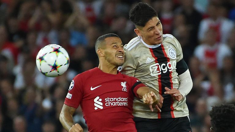 Liverpool's Thiago jumps for the ball with Ajax's Edson Alvarez
