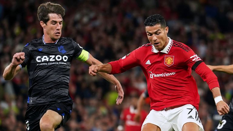 Real Sociedad's Aritz Elustondo challenges Manchester United's Cristiano Ronaldo 