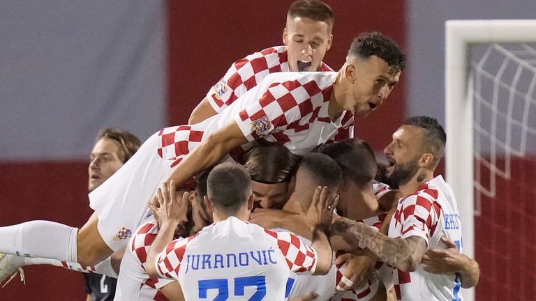 Croatian players celebrate after Borna Sosa's opening goal during the football match between Croatia and Denmark at Maximir Stadium on Thursday, September 22, 2022 in Zagreb.  (AP Photo/Darko Bandick)
